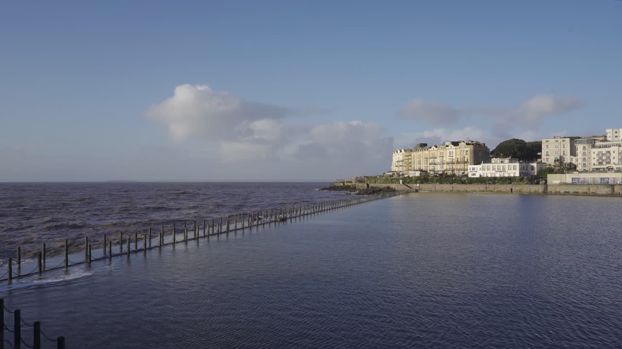 WESTON SUPER MARE, SOMERSET, ENGLAND, December 23, 2019: Marine lake built in nineteen twenty seven to facilitate bathing at low tide. Foot path flooded.