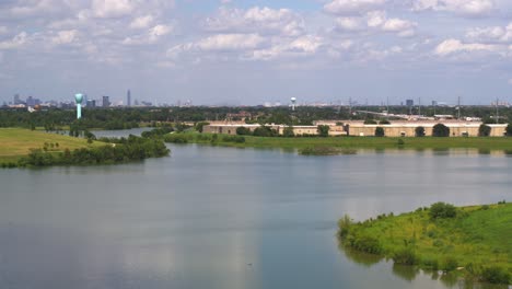 drone view of large lake in west houston with the galleria area in the far background