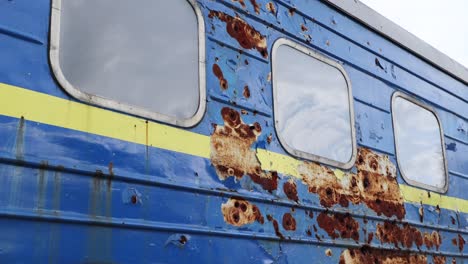 ukrainian civil train covered in shrapnel and bullets from russian attack on display in kyiv war exhibition at sophia square