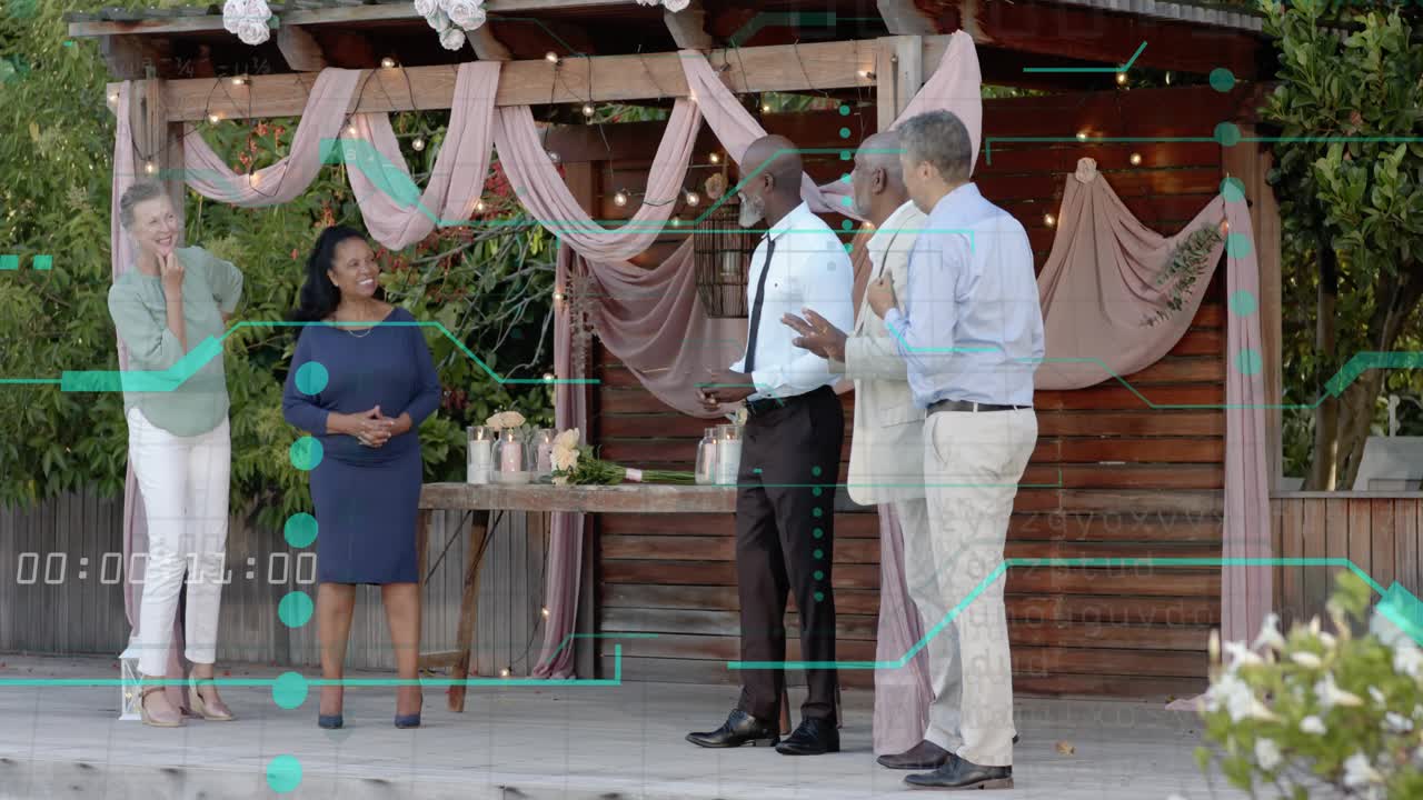 Centered man reading notes, group of five shifting under pink drapery pergola during ceremony