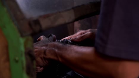 cobbler meticulously crafts shoes by hand, skillfully shaping footwear