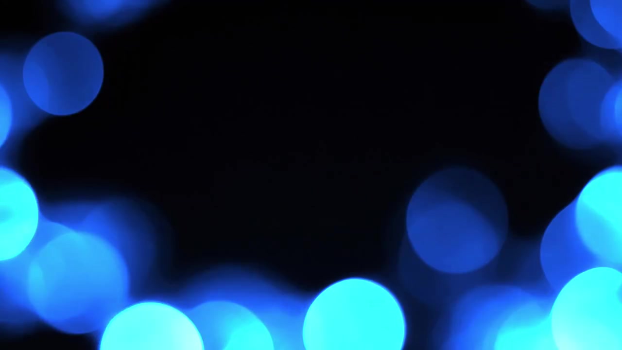 Abstrakte blaue Bokeh-Lichter leuchtend auf schwarzem Hintergrund