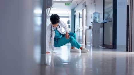 hospital, woman and doctor on the floor