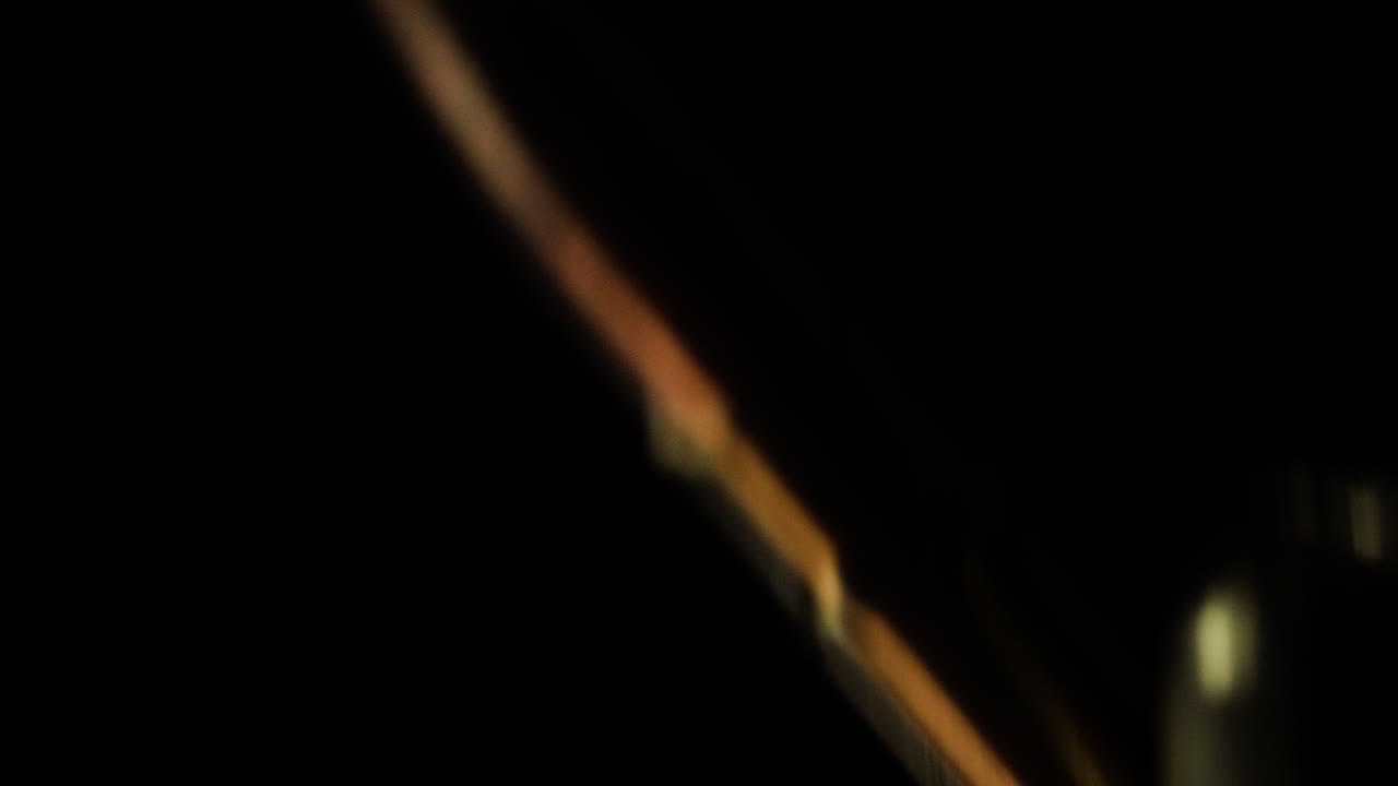 300 Blackout bullets falling before a dark background, slow motion, close-up