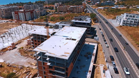 new homes being built. construction progress on multiple residential buildings in a rural area, showcasing cranes and unfinished structures