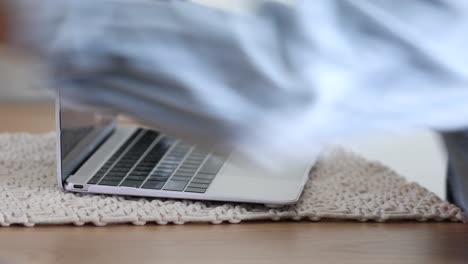 A-woman-cleans-and-sanitizes-her-computer-screen-and-keyboard-during-the-Covid19-coronavirus-pandemic-epidemic