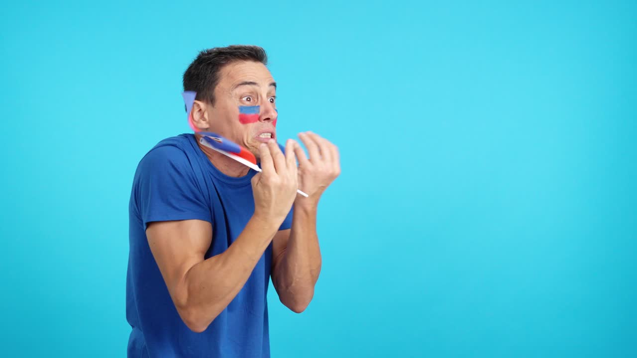 Man cheering for Haiti, angry with the decision of referee