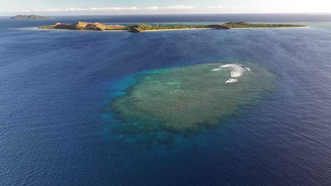 Top diving spot in Fiji, coral reef by paradise Mana Island. Tropical island vibe, holiday.