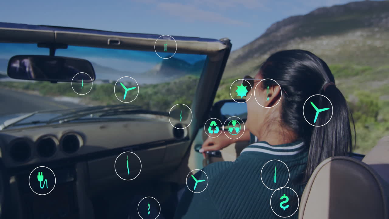 animación de iconos de la ecología sobre una mujer biracial feliz en un viaje por carretera sonriendo en el coche