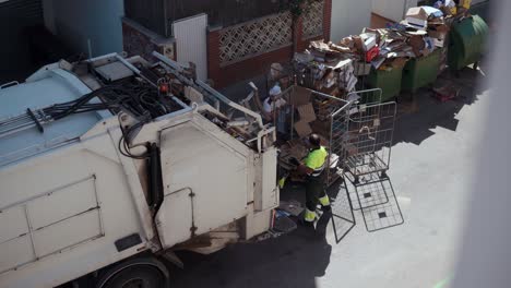 garbage truck and workers collecting recyclable materials