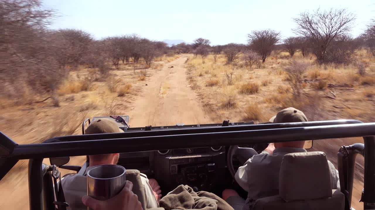 POV shot from a fast moving safari jeep on the plains of Africa Erindi Park Namibia