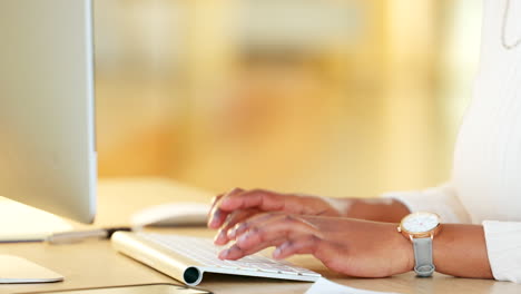 business manager writing an email on a computer