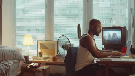 African-American-Man-Using-Laptop-at-Home