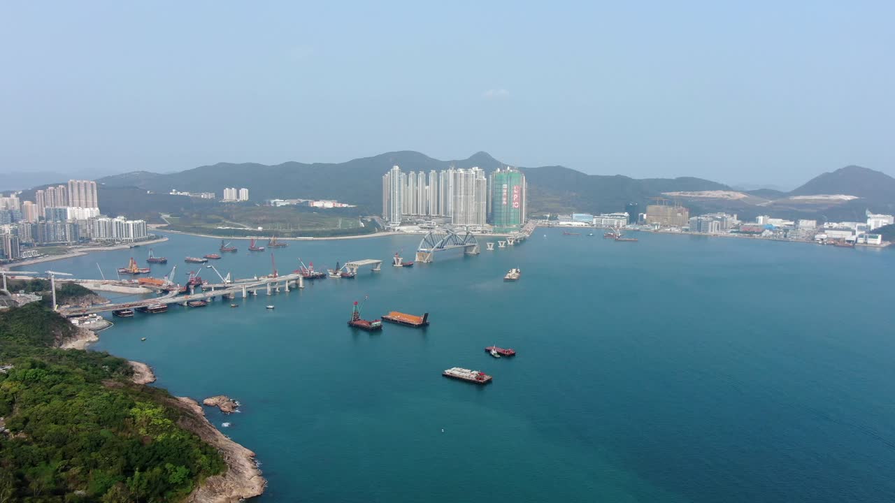 proyecto de construcción del enlace cruzado de la bahía de hong kong, un puente doble de dos carriles que conecta el túnel tseung kwan o lam tin con la carretera wan po, vista aérea