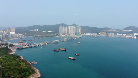 Hong-Kong-cross-bay-link-construction-project,-a-dual-two-lane-bridge-connecting-Tseung-Kwan-O-Lam-Tin-Tunnel-to-Wan-Po-Road,-Aerial-view