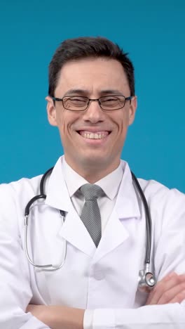 portrait of a smiling male doctor in a white lab coat with a stethoscope