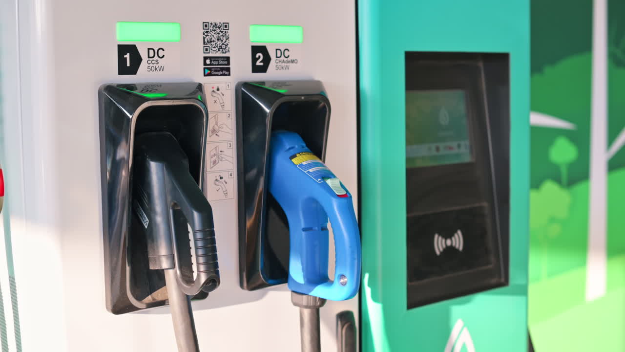 Electric car charger with two plugged in pistols