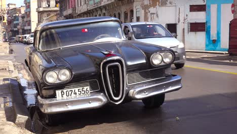 an old fashioned edsel car sits on the streets of havana cuba