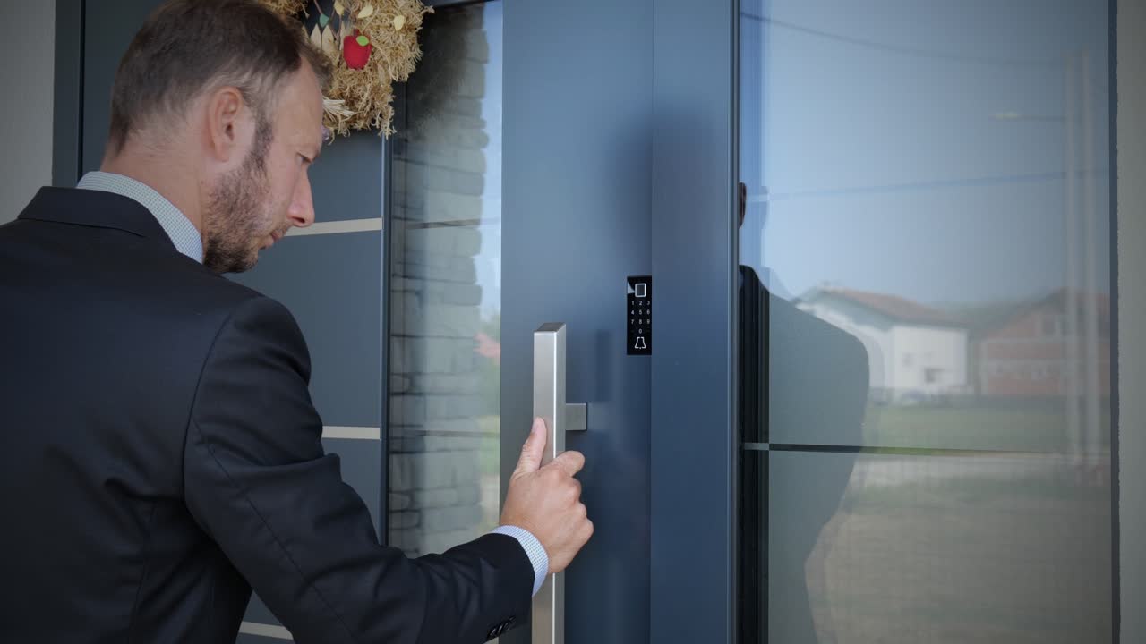 Business man using fingerprint to unlock smart key home entrance, future concept