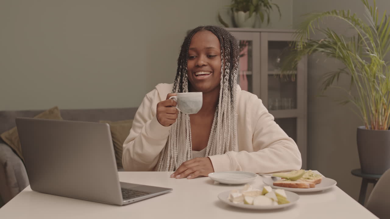 African American Woman Video Chatting from Home