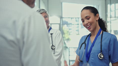 Doctor,-handshake-and-team-in-meeting