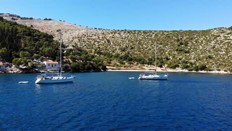 yachts on the scenic seascape of agia sofia in greece - aerial drone shot