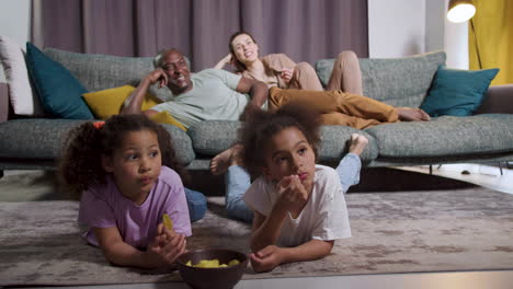 family watching film at home