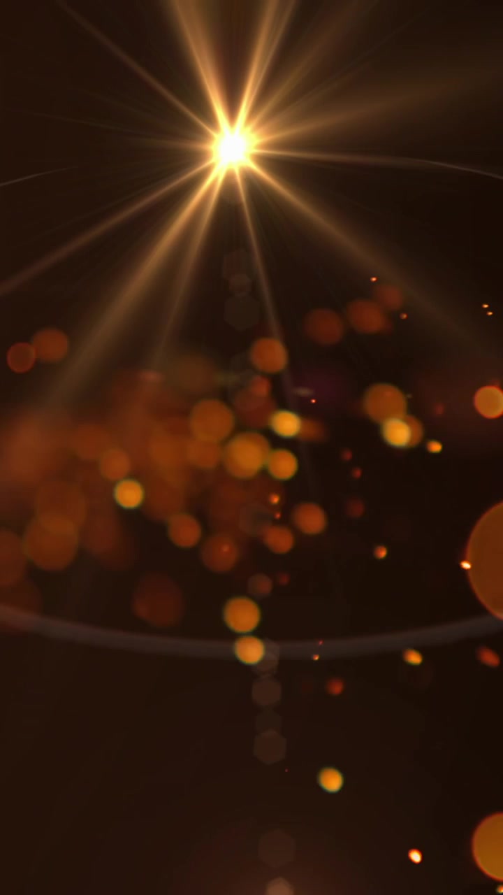 Scintille di luce arancioni luminose e punto di luce su sfondo nero