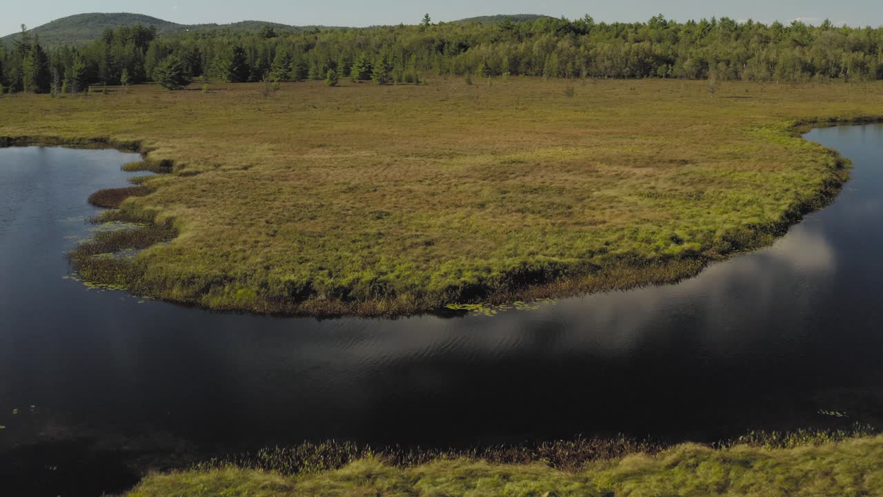 Aerial shot approaching meandering Union River, Eastern Maine