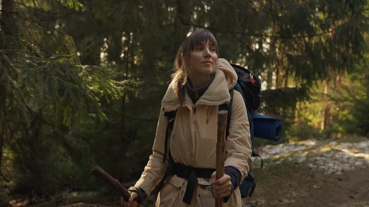 Woman Backpacking in Forest