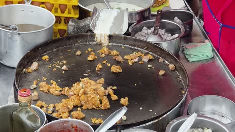 cooking street food on a hot pan