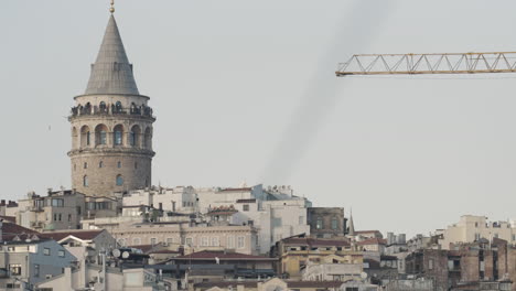 galata tower and istanbul cityscape with construction crane