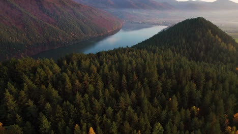 drone aerial, autumn landscape, peaceful valley, hill and river, evening