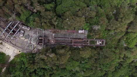 Overhead-drone-flight-over-the-ruins-of-the-old-cable-car-station-El-Liron,-located-in-San-Antonio-de-Galipan,-Venezuela