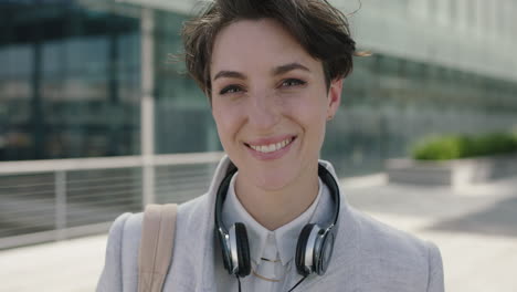 portrait-of-beautiful-young-business-woman-executive-smiling-happy-enjoying-new-corporate-career-in-city