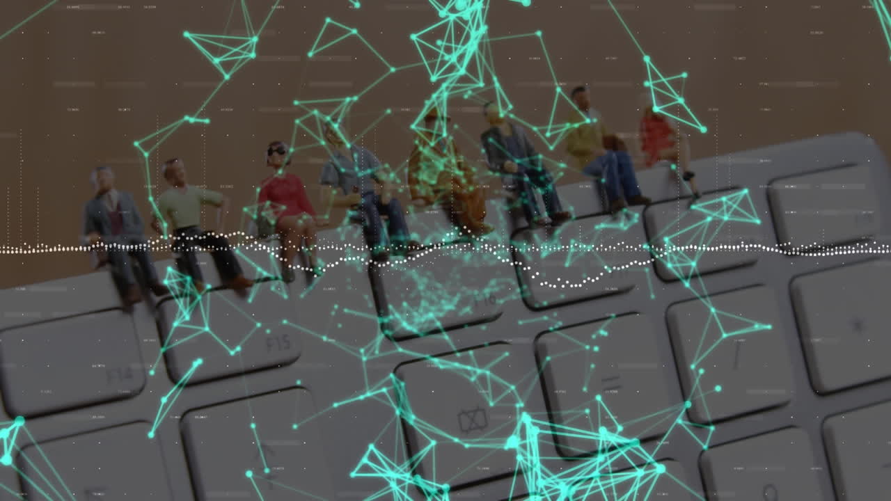 Animation of network of connections over people figurines on computer keyboard