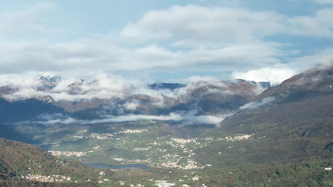 Stunning aerial view of the Alps under a blanket of clouds in Italy