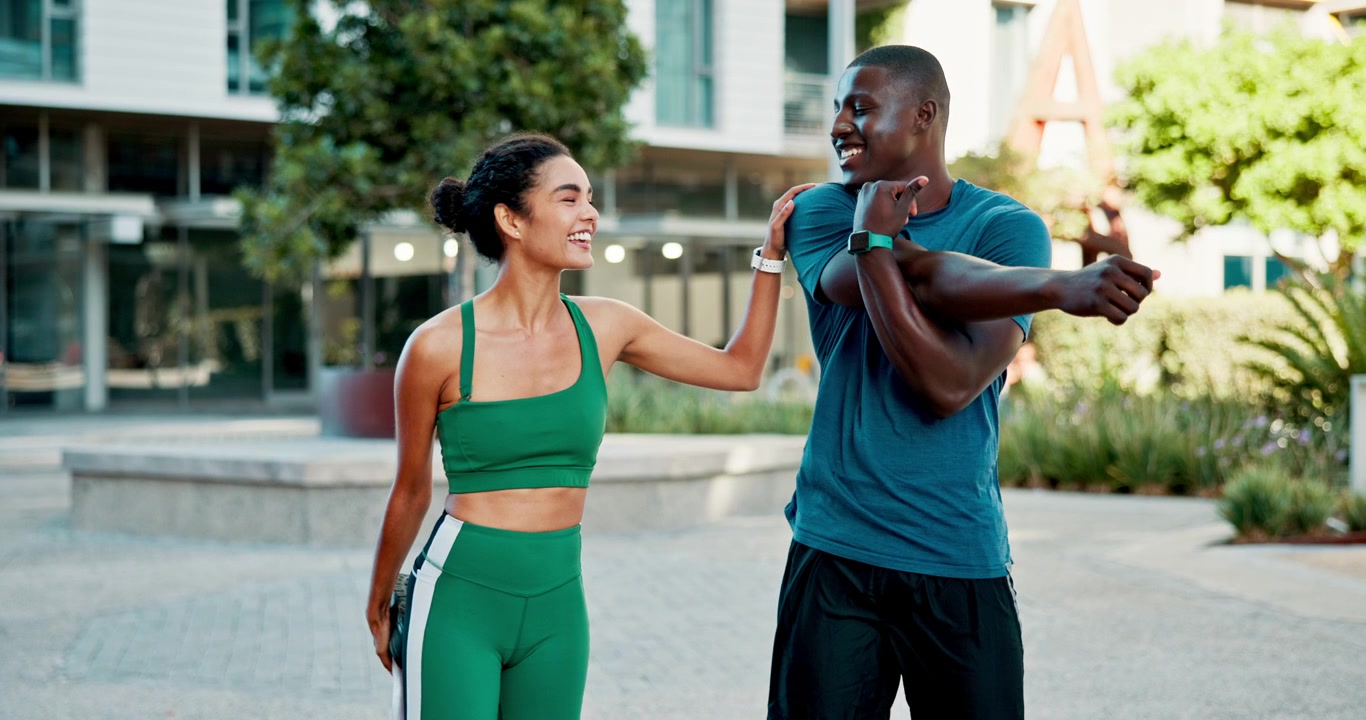 Fit Couple Stretching Together Outdoors in Urban Setting