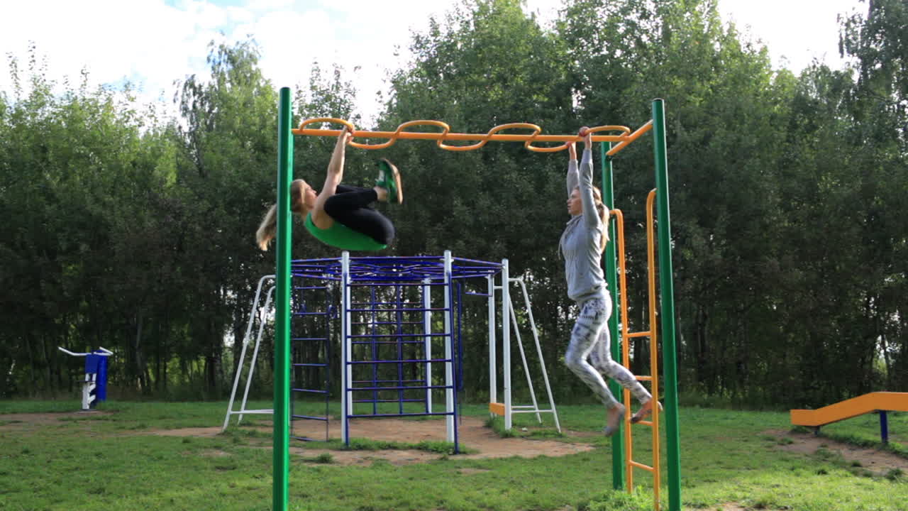 Two girls on sports ground