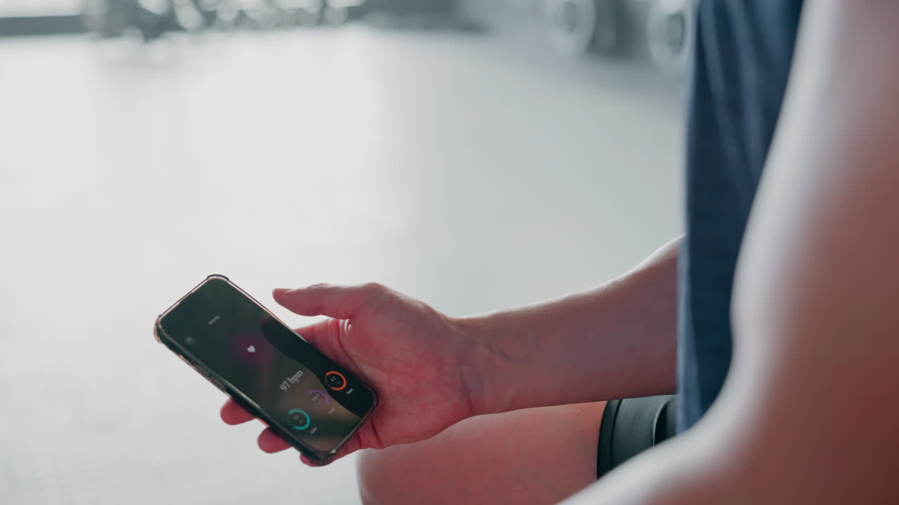 Fitness, mobile app and phone in hands for workout