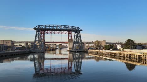 Low-Aerial-Of-Puente-Transbordador-And-Still-Water-In-Buenos-Aires