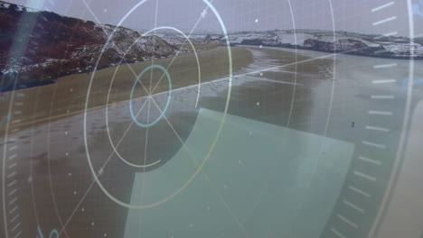 paddleboarding rider riding board over aerial sandy beach bay, showing hud overlay with gridlines