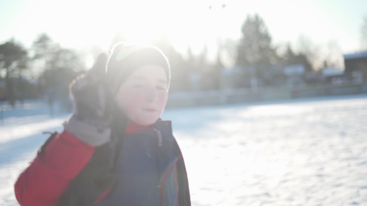 Boy giving the peace sign.