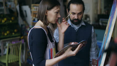couple painting in an art studio