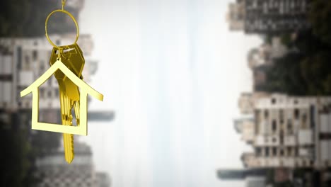 Animation-of-gold-house-key-and-fob-over-out-of-focus-cityscape