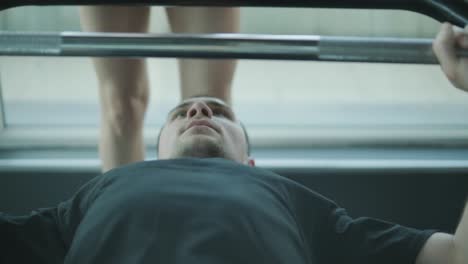 man and woman working out at the gym