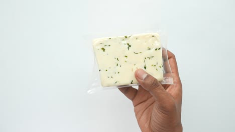 hand holding a fresh cheese on white background,