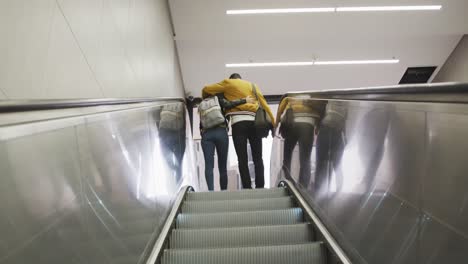 rear view of caucasian couple on the go during coronavirus pandemic