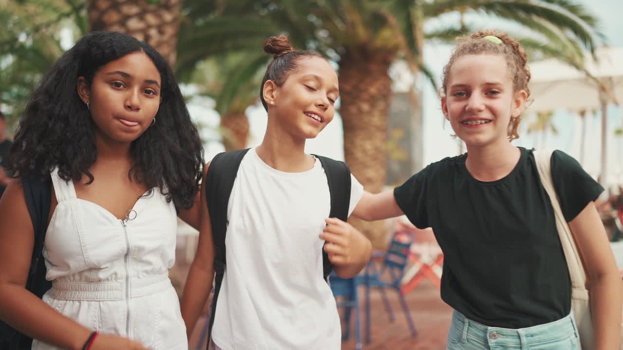 Three Teenage Friends Posing Outdoors