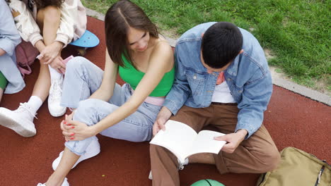 top view of students sitting on running track